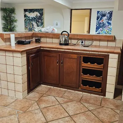 a kitchen with a sink and a mirror at JoLi Larano - BBQ In in Machico