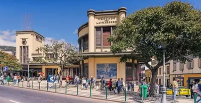 a group of people standing in front of a building at Funchal City Yellow Townhouse and Terrace in Funchal
