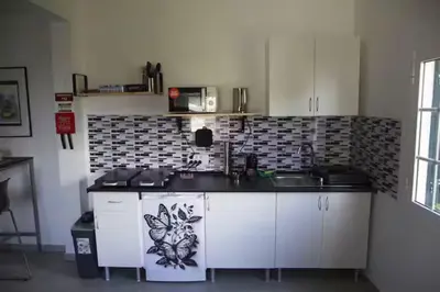 a kitchen with a table with blue plates on it at House Villa Butterfly in Santana