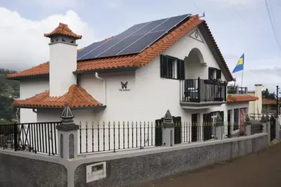 a house with solar panels on the roof at House Villa Butterfly in Santana