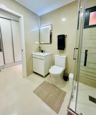 a bathroom with a toilet and a sink and a shower at Carreira Vicente by Olá Madeira in Funchal