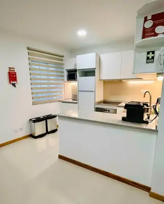 a kitchen with white cabinets and a counter top at Carreira Vicente by Olá Madeira in Funchal