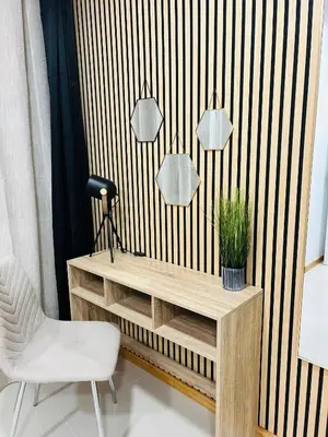 a desk with a chair and two mirrors on a wall at Carreira Vicente by Olá Madeira in Funchal