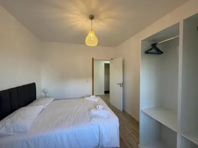 a bedroom with a bed with towels on it at Charming Sunset flat in Paul do Mar