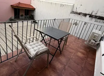 a table and chairs sitting on a balcony at Apartment Minorca 2 in Funchal