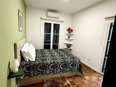 a bedroom with a bed and a window at Apartment Minorca 2 in Funchal