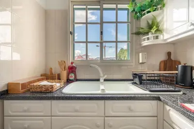 a kitchen with a sink and a window at Sun & Roses in Funchal