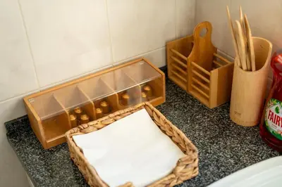 a mirror sitting on a counter next to a box of chopsticks at Sun & Roses in Funchal
