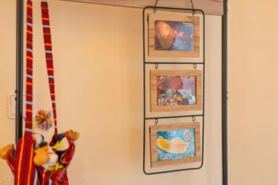 a group of framed pictures hanging on a wall at Sun & Roses in Funchal