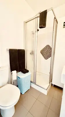 a bathroom with a shower and a toilet at Madeira Ocean Suite 1 in Funchal