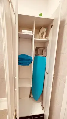 a bathroom with a blue toilet in a closet at Madeira Ocean Suite 1 in Funchal