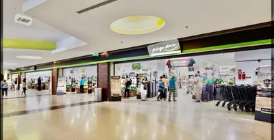 a shopping mall with people walking through a store at Madeira 1003 in Funchal