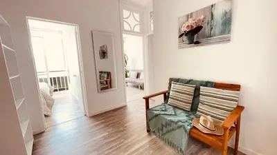 a living room with a couch and a table at Madeira 1003 in Funchal