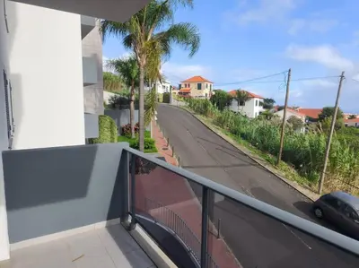 a view of a street from a balcony of a house at Alojamiento Local - Nilia in Caniço