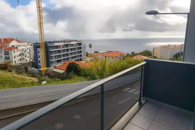 a balcony with a view of a city at Alojamiento Local - Nilia in Caniço