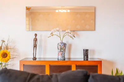 a living room with a couch and a table at Caniço Horizon Apartment by Amazing Madeira in Caniço