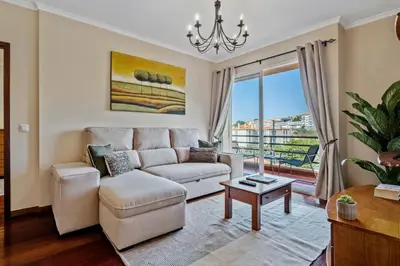 a living room with a couch and a table at Our Nest by ALMA Holiday Rentals in Caniço