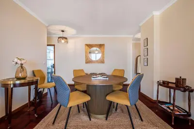 a dining room with a table and chairs at Nata7 Apartment in Funchal