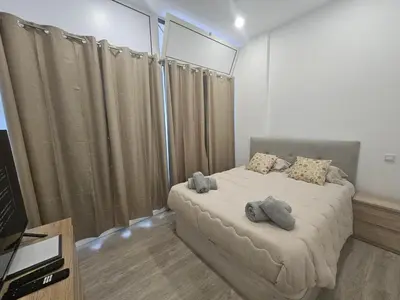 a bedroom with a bed with two pillows on it at Faty`s Place by Susys Holidays in Santa Cruz