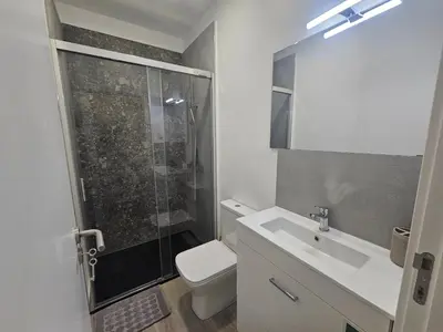 a bathroom with a shower and a toilet and a sink at Faty`s Place by Susys Holidays in Santa Cruz