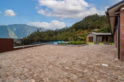 a patio with a view of a mountain at Vilaugusto in São Vicente