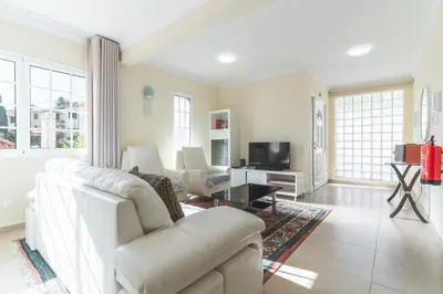 a living room with a couch and a tv at Santo Antonio View by Atlantic Holiday in Funchal