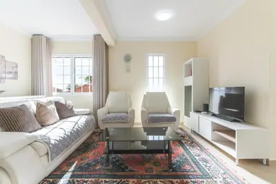 a living room with a couch and two chairs at Santo Antonio View by Atlantic Holiday in Funchal