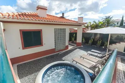 a backyard with a pool and a water slide at Santo Antonio View by Atlantic Holiday in Funchal