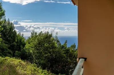 a view of the ocean from a building at Brisa do Caniço in Caniço