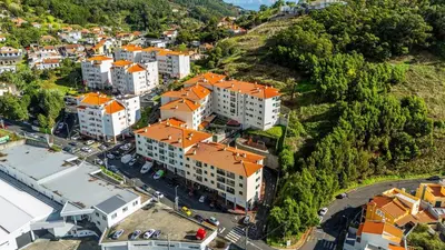 an overhead view of a city with orange roofs at Brisa do Caniço in Caniço