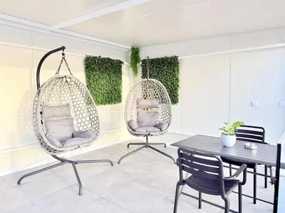 a white kitchen with a washer and dryer at Atlantic Harmony Residence in Funchal