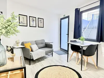 a large bed with a black and white striped headboard at Atlantic Harmony Residence in Funchal