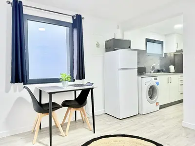 a kitchen counter with a sink and a microwave at Atlantic Harmony Residence in Funchal