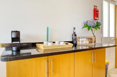 a kitchen with a counter top with aounter at Ponta do Sol Sea View, a Home in Madeira in Ponta do Sol
