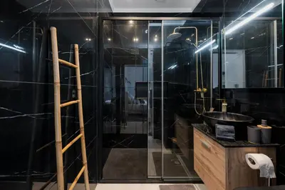 a bathroom with a shower and a sink at Stylish 1 Bed Room in Funchal