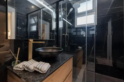 a bathroom with a bowl sink and a shower at Stylish 1 Bed Room Studio Flat in Funchal