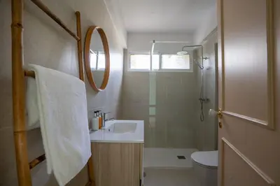 a bathroom with a sink and a shower and a toilet at Villa Jasmin by Atlantic Holiday in Caniço