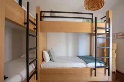 a bunk bed room with two bunk beds at Villa Jasmin by Atlantic Holiday in Caniço