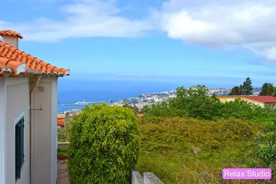 a view of the ocean from a house at Villa Henriques in Funchal