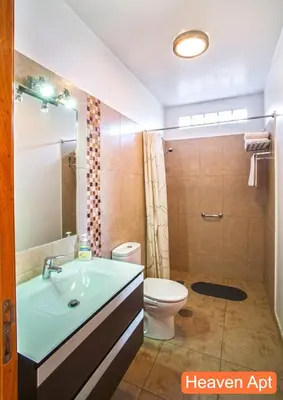 a bathroom with a sink and a toilet at Villa Henriques in Funchal