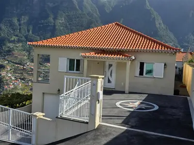 a house with a gate and a driveway at Villa Margarida São Vicente Madeira in São Vicente