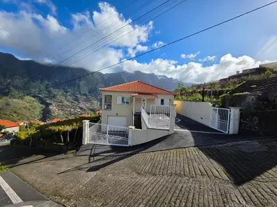 a house with a view of the mountains at Villa Margarida São Vicente Madeira in São Vicente