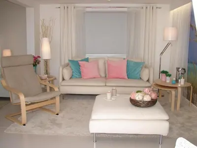 a living room with a couch and a chair at Crystal Madeira Studio in Funchal