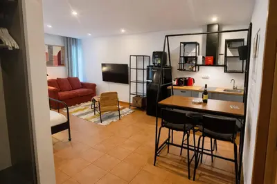 a room with a kitchen and a living room at Frutti studio by Turin in Funchal