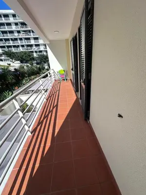 a balcony with a view of a building at Heart of Madeira Funchal in Funchal