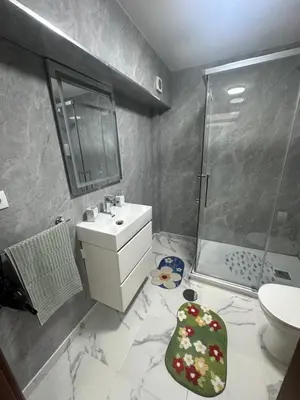 a bathroom with a sink toilet and a shower at Heart of Madeira Funchal in Funchal