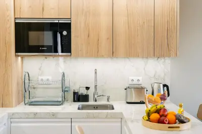 a kitchen with a bowl of fruit on the counter at Linda Vista Apartment by Amazing Madeira in Funchal