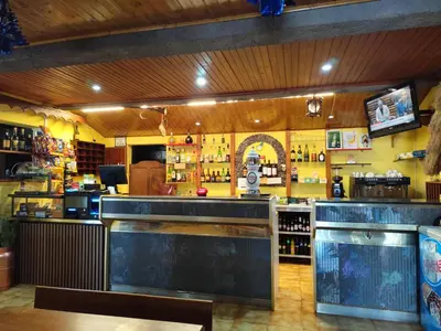 a room with a bunch of bottles of wine at IlhaMontanha - Serras da Ilha in Santana