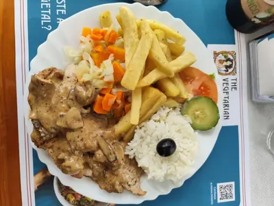 a plate of food with rice and french fries at IlhaMontanha - Serras da Ilha in Santana