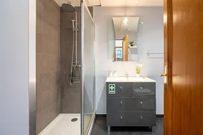a kitchen with a washing machine in a kitchen at GuestReady - Charming Apartment with Ocean Views in Caniço